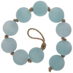 Length: 22.44" Thickness: 1.97" Material: Sea Glass & Jute Color: Blue & Beige Quantity: 1 Create a tranquil space in your home with the elegance and texture of this Light Blue Sea Glass Garland. Featuring opaque sea glass bulbs on a knotted jute rope, this beaded garland will make the perfect addition to your sea-inspired displays. Strategically arrange this garland alongside other coastal decor to elevate your home's beachy style with a refined touch! Coastal Farmhouse Decor Bathroom, Coastal Christmas Decor Ideas, Sea Grass Decor, New England Coastal Decor, Coastal Decorating Ideas, Coastal Cottage Decor, Costal Bedroom, Coastal Room Decor, Sea Glass Decor