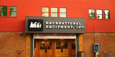 an entrance to a building with two doors and the words recreational equipment, inc on it