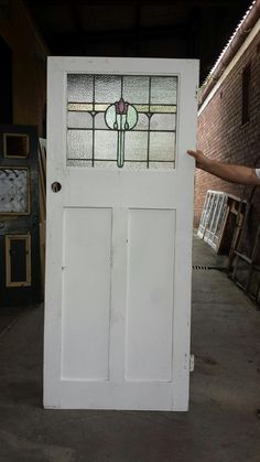 a white door with stained glass on it