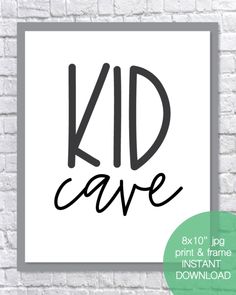 a black and white poster with the word kid cave on it, next to a brick wall