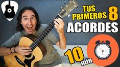 a man is playing an acoustic guitar with the words'tus primeros 8 accordes '