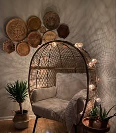 a living room filled with furniture and lots of lights on the wall next to it