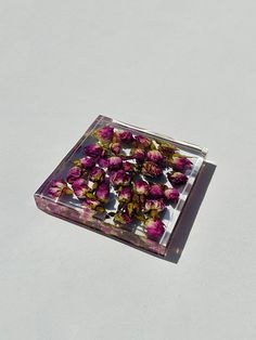 a glass plate with pink flowers on it