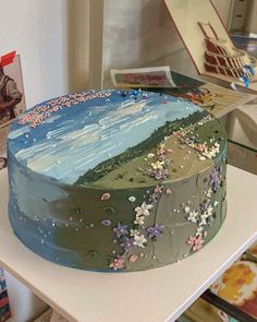 a decorated cake sitting on top of a table