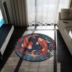 a living room with a couch, television and koi fish rug on the floor