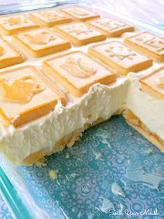 a cake that has been cut in half and is sitting on a blue tablecloth