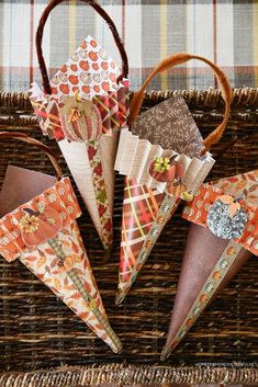 four paper cones sitting on top of a wicker basket