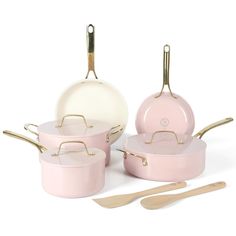 pink pots and pans with wooden utensils