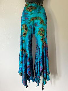 Free shipping!  Tie dye flare leg culottes pants. Super Stretchy and easy to move and dance in. One size fits S-L   Colors may vary depending on flash on camera ◡̈ Hippie Wide Leg Flares For Spring, Hippie Wide Leg Spring Flares, Spring Hippie Wide Leg Flares, Summer Cotton Full-length Flares, Bohemian Fitted Wide Leg Flares, Stretch Hippie Pants For Festivals, Stretch Summer Bottoms With Wide Hem, Cotton Flare Pants For Festivals, Festival Flare Cotton Pants