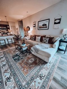 a living room filled with furniture and decor