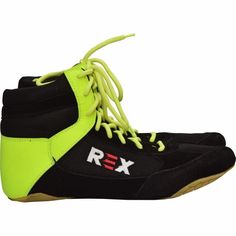 a pair of black and yellow shoes with neon green laces