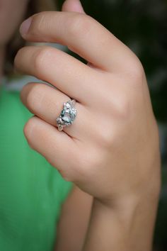 a woman's hand with a ring on it