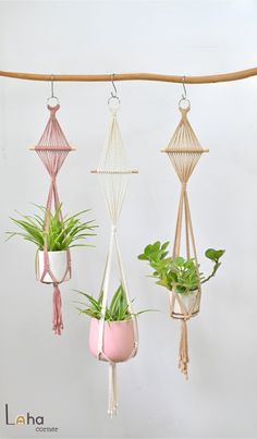 four hanging planters with plants in them