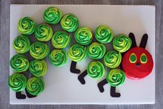 cupcakes with green and blue frosting shaped like a caterpillar