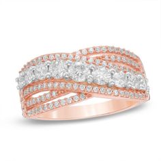 Remind her she's the light of your life with this extraordinary diamond ring. Crafted in precious 10K rose gold, this brilliant style features criss-crossing rows of diamonds to create the split shank, while wider row of diamonds -the largest the 1/8 ct. Center stone - crosses over in shimmering splendor. Radiant with 1 ct. t.w. of diamonds and a bright polished shine, this dazzling design is a symbol of your love. Diamond Crossover Ring, Zales Zales, Diamond Claddagh Ring, 1 Carat Diamond Ring, Crossover Diamond Ring, Crossover Ring, E Commerce Website, Right Hand Rings, Circle Diamond