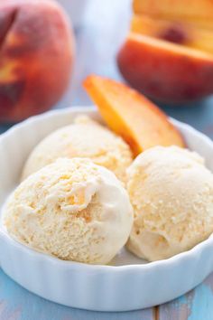 two scoops of ice cream in a bowl with an apple behind it and text overlay that reads homemade peach ice cream only 6 cents per serving