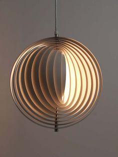 a circular light fixture hanging from a ceiling