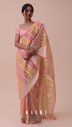 Elevate your style with our exquisite carrot orange saree adorned with rangkat designs.
Handloomed using the finest chanderi cotton kora silk fabric this saree exudes simplicity and elegance. Isha Borah, Saree Modern, Durga Chalisa, Saree Outfits, Sari India, Kora Silk Sarees, Simple Saree Designs, Chanderi Saree, Orange Saree