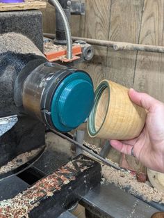 a person is using a grinder to make something out of some kind of wood