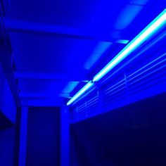 a blue light is shining on the ceiling