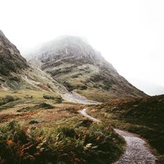 a path in the middle of some mountains