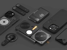 several different types of cell phones and accessories on a black surface, including an external camera