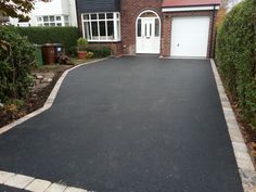 a house with a driveway that has been paved