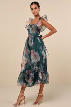 a woman in a dress with flowers on it