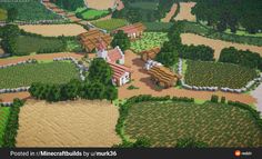 an aerial view of a small village in the middle of a field with trees and bushes