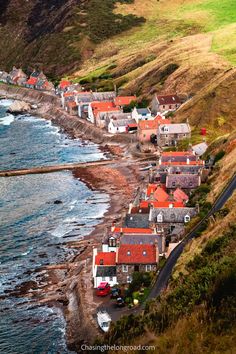 an aerial view of houses along the coast