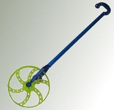 a green and blue plastic wheel on a white background with the handle extended to it's side