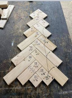 a christmas tree made out of wooden planks