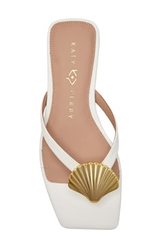 A metallic seashell shines at the vamp of a beach-ready flip-flop secured with a center toe post and grounded by a well-cushioned footbed. Memory foam cushioning Synthetic or synthetic and textile upper/synthetic and textile lining/synthetic sole Imported Bridal Shoes Beach Wedding, White Beach Sandals, Seashell Shoes, Fancy Flip Flops, Rainbow Heels, Shoe Wishlist, Boot Jewelry, Sandals White, Beach Ready