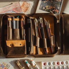 Artist brush bag is made of genuine leather and will hold all that you need. It's a perfect case to keep pens, pencils, and brushes in one place. We offer it in 8 colors. The multifunctional bag includes removable parts, allowing you to customize the internal organization according to your individual needs.  Also, you can add personalization. ♦ ♦ ♦ ♦ ♦ ♦ ♦ ♦ ♦ ♦ ♦ ♦ ♦ ♦ ♦ ♦ ♦ ♦ All our products are made to order with great care and special attention in our workshop. It's a unique handcrafted ite Everyday Pencil Case With Pen Slots, Leather Pencil Case With Pen Slots For Travel, Artistic Pencil Case With Pen Slots, Artist Bag, Brush Organizer, Back To School Organization, Oil Brush, Artist Brush, Leather Roll