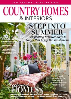 the front cover of country homes and interiors magazine, featuring a bench with flowers on it