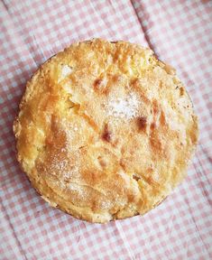 a pie sitting on top of a checkered table cloth