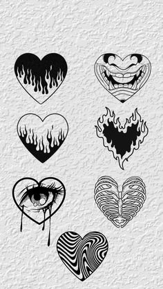 four different heart tattoos on white paper