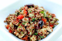 a white bowl filled with rice and vegetables