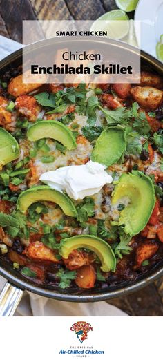 chicken enchilada skillet with avocado and sour cream on top