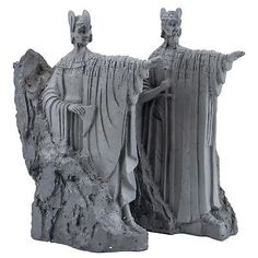 two statues of people standing next to each other