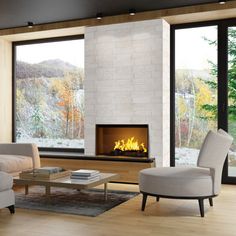 a living room filled with furniture and a fire place in front of a window that looks out onto the woods