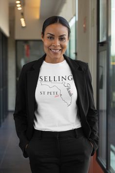 a woman wearing a t - shirt that says selling st pete in front of her