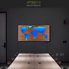 a conference room with a large wooden world map on the wall