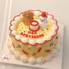 a birthday cake decorated with frosting and teddy bears