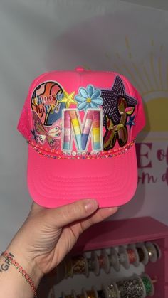 Have you been wanting one of those popular custom trucker hats? Want your hat to be made in a video and posted on TikTok? Well look no further!  Price includes up to 5 patches. Any additional patches are priced by size. Please message the seller for pricing sheet!  Chains are additional cost, please be sure to add them if they are wanted! Fun Adjustable Baseball Cap With Embroidered Patch, Fun Adjustable Hats With Patches, Fun Adjustable Hat With Patches, Pink Fun Trucker Hat With Flat Bill, Pink Fun Style Trucker Hat With Flat Bill, Fun Pink Trucker Hat With Flat Bill, Custom Embroidered Snapback Trucker Hat, Pink Fun Flat Bill Trucker Hat, Customizable Snapback Trucker Hat