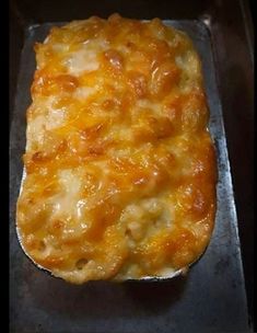 a cheesy casserole in a pan ready to be cooked on the stove