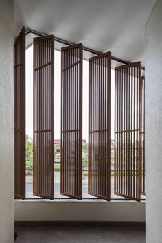 an open window with wooden slats on it