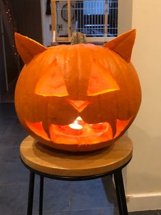 a pumpkin carved to look like a cat