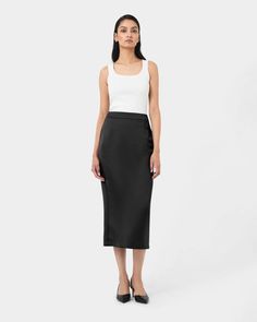 Upgrade your wardrobe with the Bel Tailored Satin Midi Skirt. Crafted from luxurious satin, this skirt features a stunning sheen and a flattering midi length that effortlessly enhances any outfit.  Tailored fit Midi length Flattering pencil fitted silhouette High waist Fixed Waistband detail Invisible centre back zipper Fully lined  Medium weight fabrication Midi Dress Work, Midi Skirt Outfit, Work Skirts, Satin Midi Skirt, Slim Leg Pants, Black Wedding Dresses, Black Midi Skirt, Knit Sweater Dress, Knit Skirt