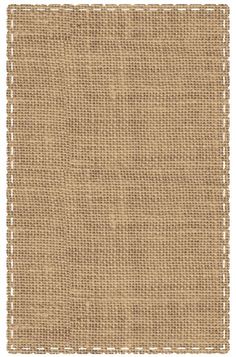 a beige rug with some white dots on it